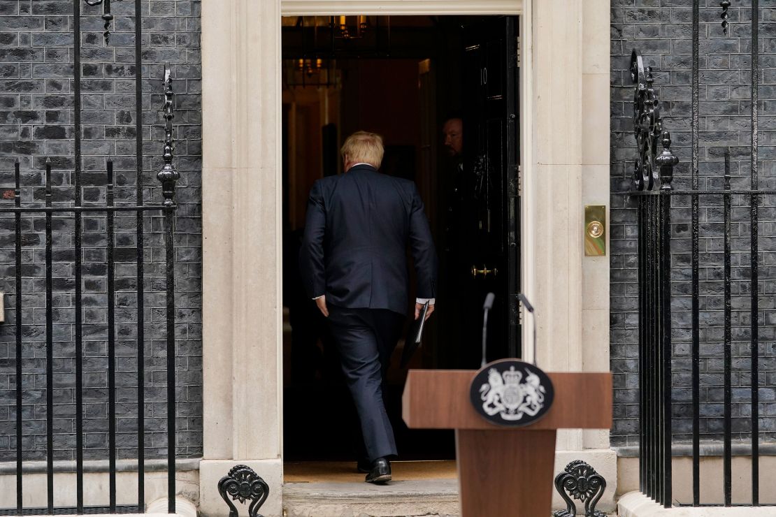 Johnson enters 10 Downing Street after reading a statement on July 7, 2022.  