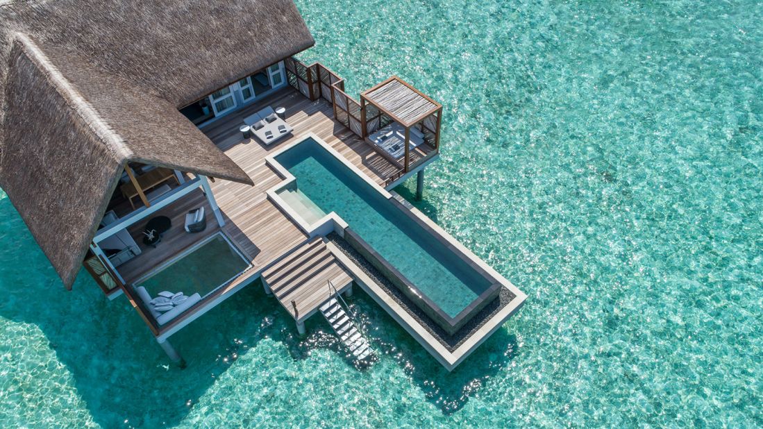 <strong>Four Seasons Resort Maldives at Landaa Giraavaru: </strong> The overwater villas at Four Seasons Resort Maldives at Landaa Giraavaru are decorated in Cobalt blues and charcoal grays.<br />For sun worshipers, the villa's giant overwater nets and soft loungers await. 