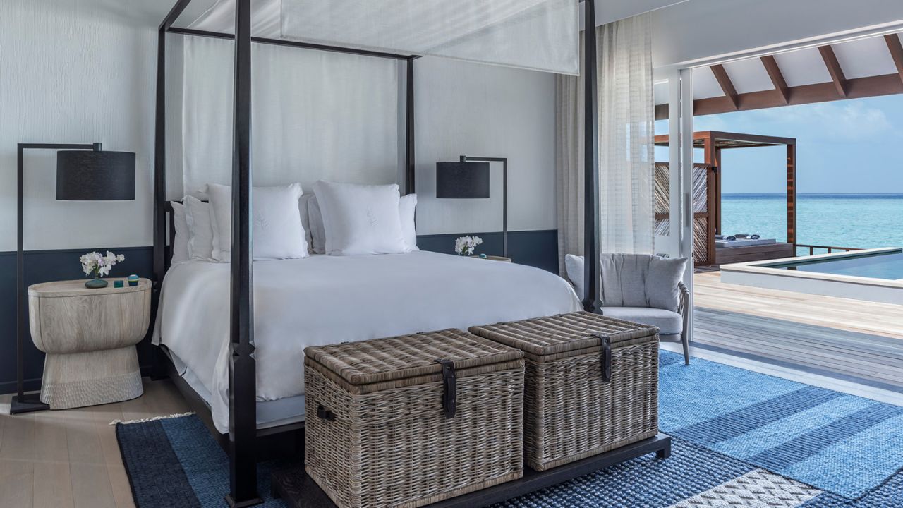The overwater villas at Four Seasons Resort Maldives at Landaa Giraavaru are decorated in Cobalt blues and charcoal grays. 