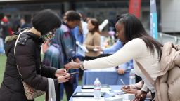 SAN FRANCISCO, CALIFORNIA - JUNE 03: A job seeker meets with a recruiter during the Healthcare Academy career and training fair outside of the Chase Center on June 03, 2022 in San Francisco, California. (Photo by Justin Sullivan/Getty Images)