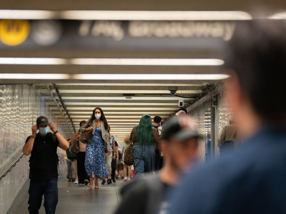 Some commuters don masks in New York's Times Square subway station last week. 