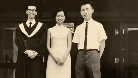 The writer's father, Ing-Ning "John" Han, right, stands with classmates on graduation day in 1970 at National Chengchi University in Taiwan. 