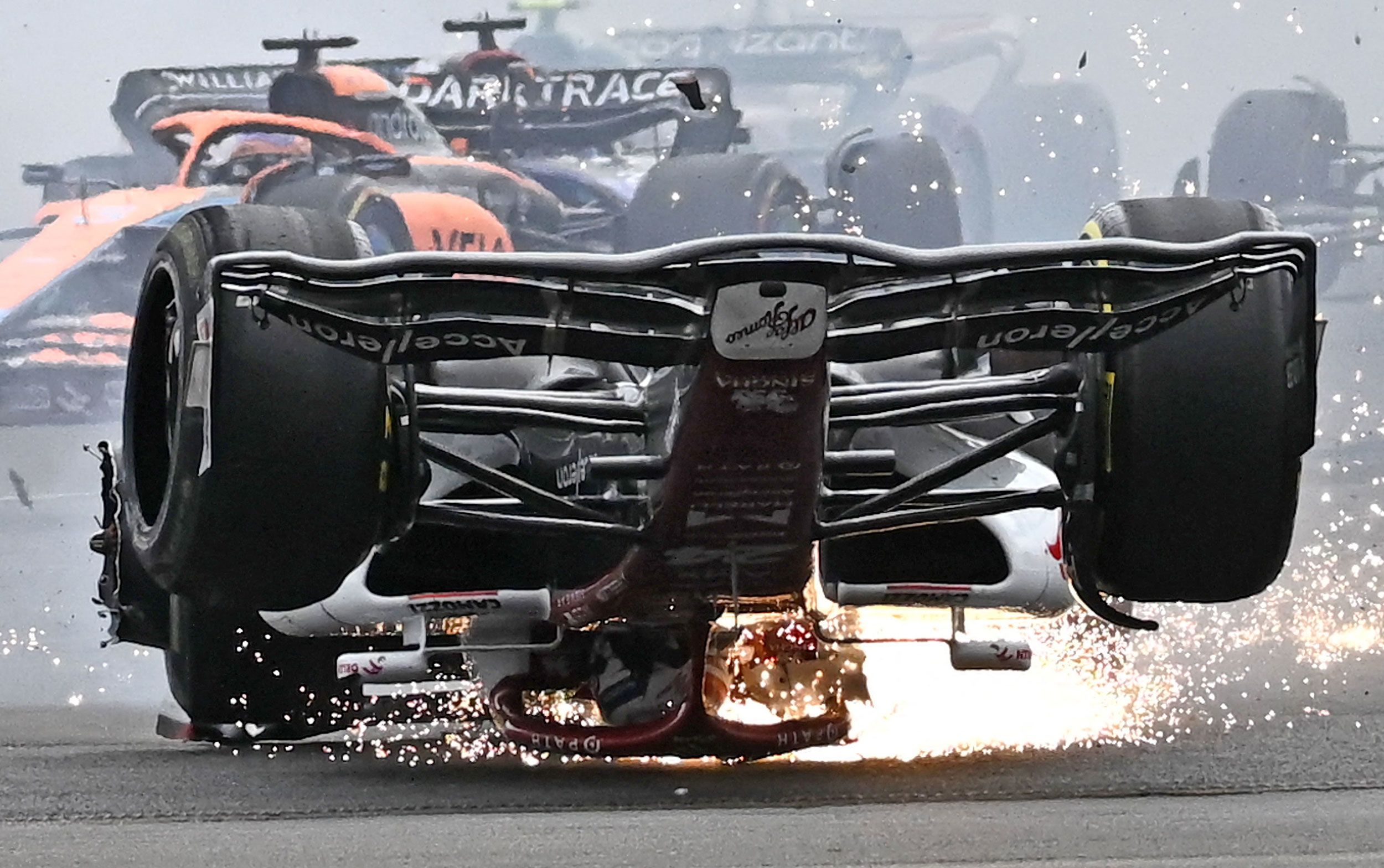 Formula One driver Zhou Guanyu skids across the track after a high-speed crash at the British Grand Prix on Sunday, July 3.