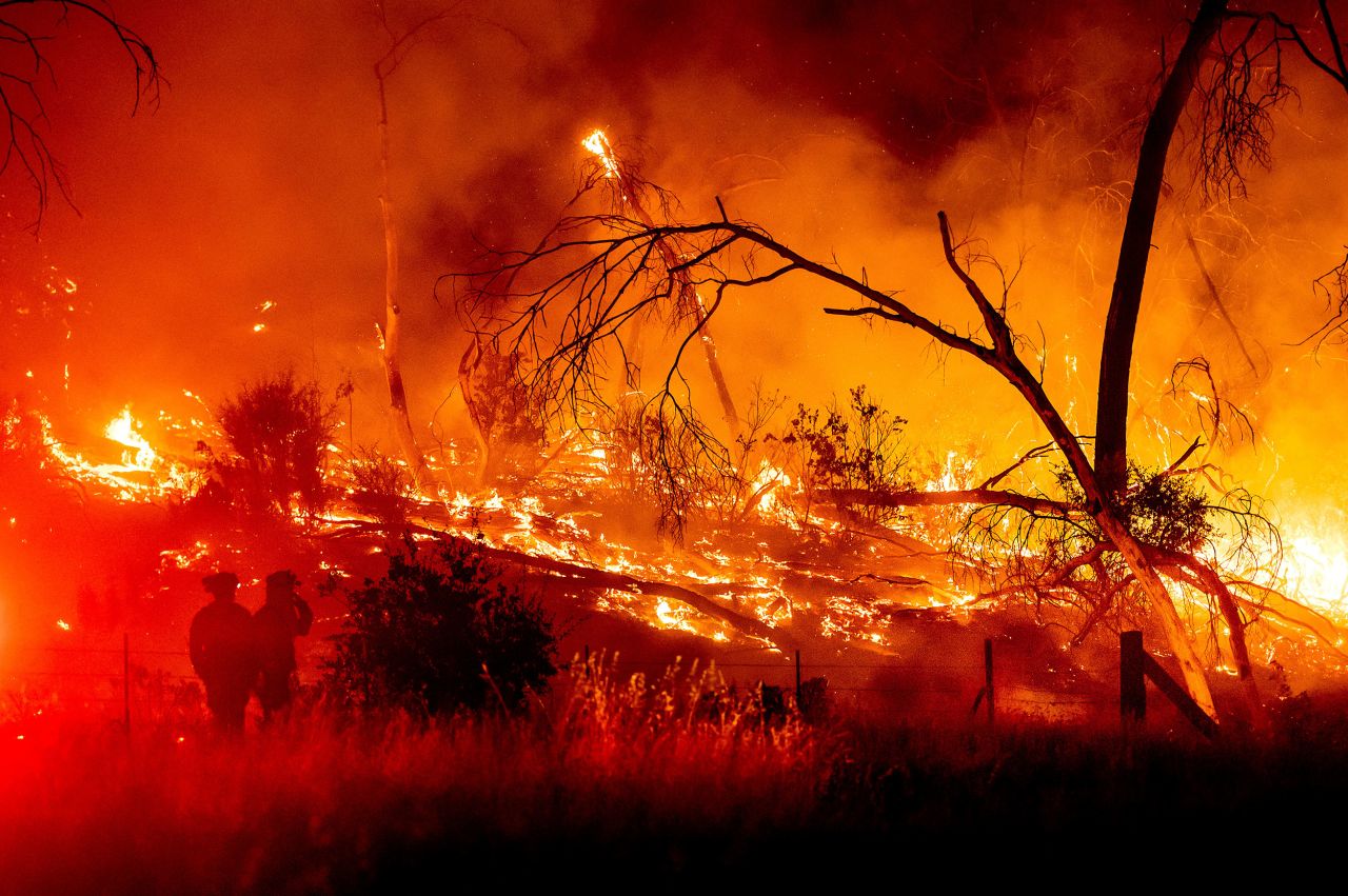 Firefighters battle the Electra wildfire in the Rich Gulch community of Calaveras County, California, on Monday, July 4.