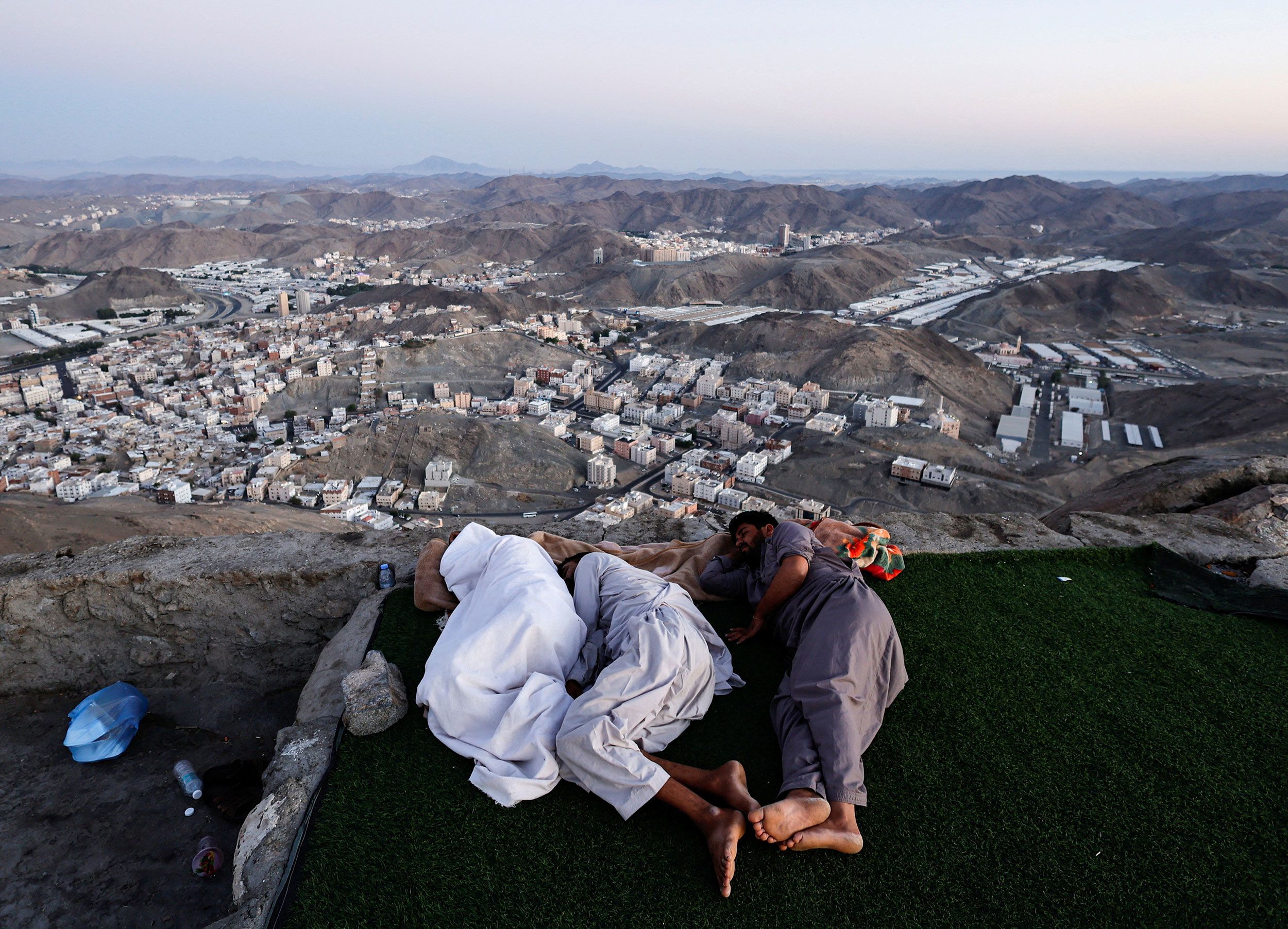 Muslim pilgrims sleep on Jabal al-Noor, a mountain near the holy city of Mecca, Saudi Arabia, on Monday, July 4.