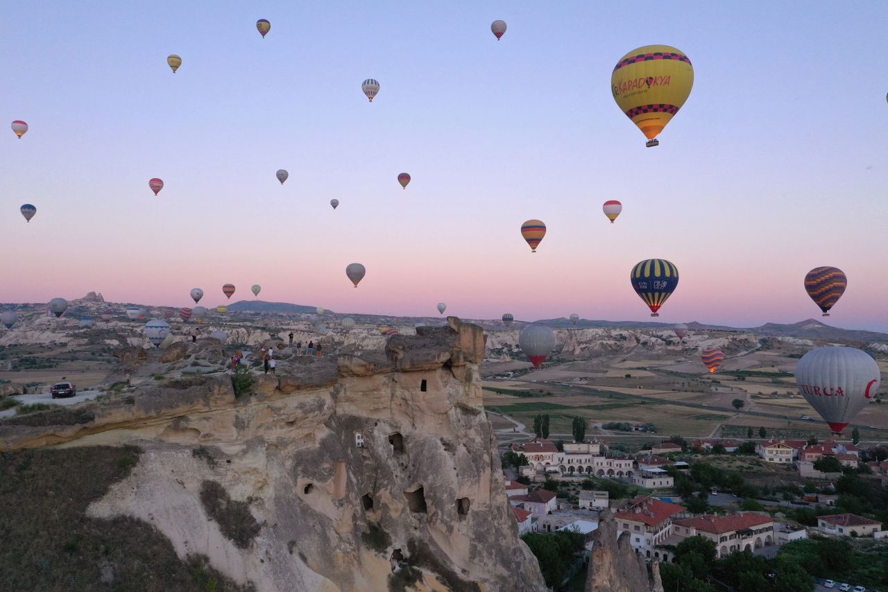 Hot air balloons glide over Nevşehir, Turkey, on Monday, July 4.