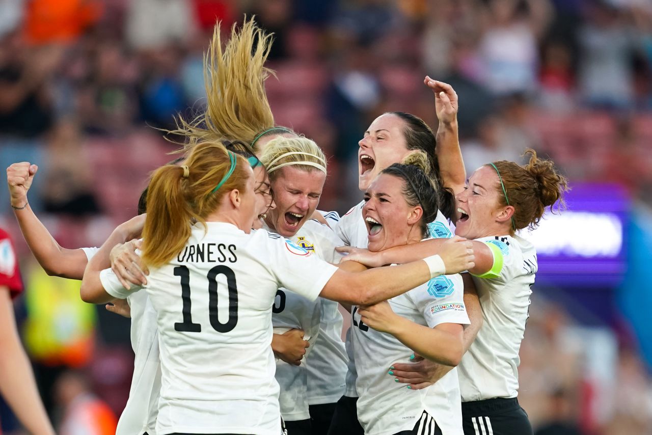 Footballers from Northern Ireland celebrate a goal during a Euro 2022 match against Norway on Thursday, July 7. Norway won the match 4-1.
