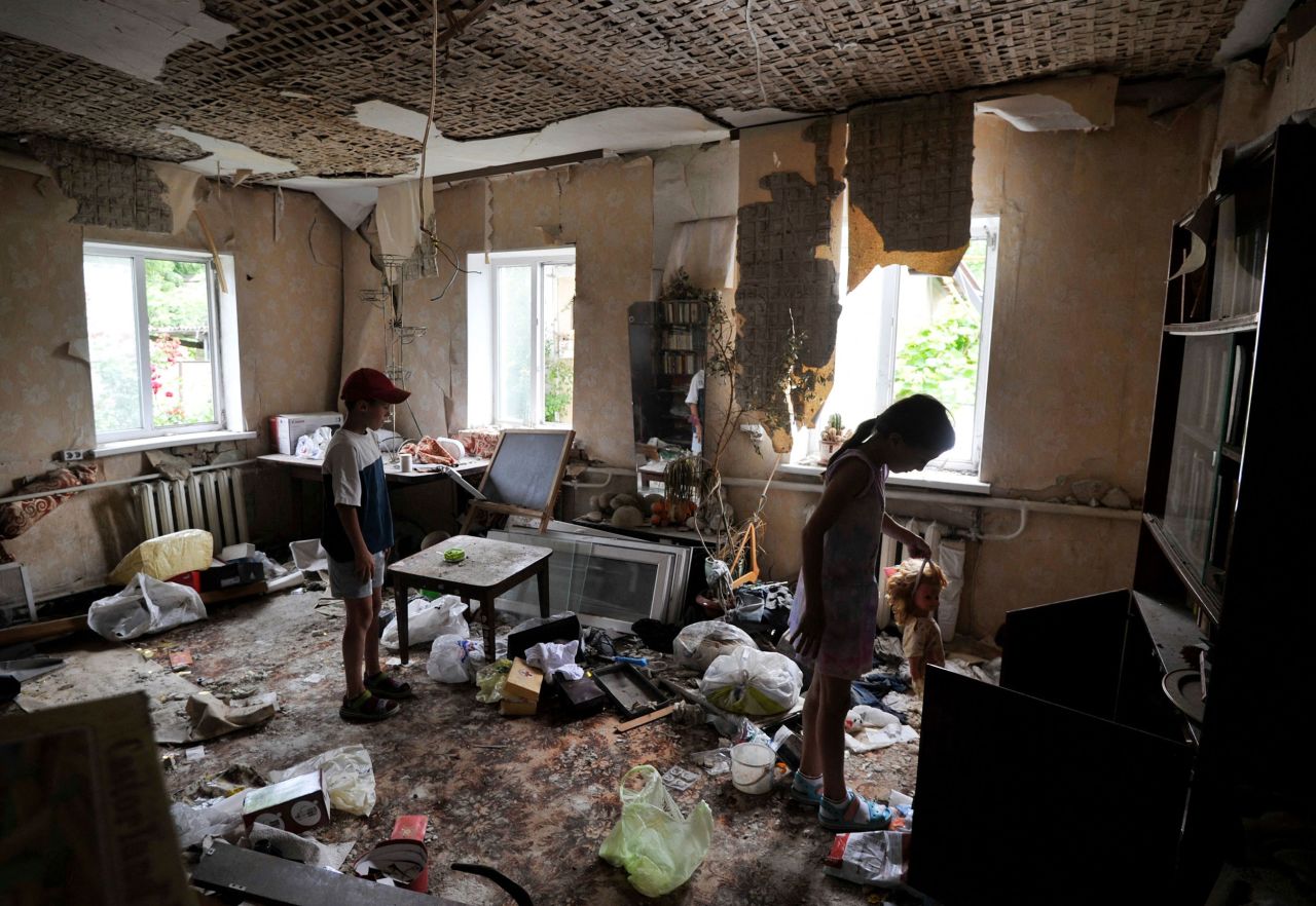Children inspect a room damaged by shelling in Borodianka, Ukraine, on Thursday, July 7.
