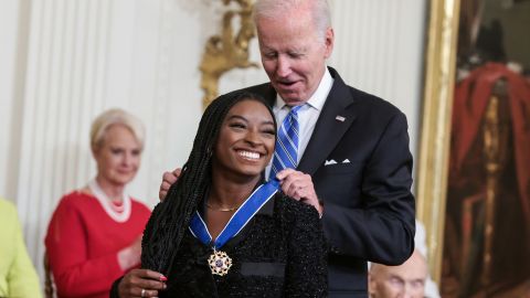 American gymnast Simone Biles receives the Presidential medal of Freedom from President Joe Biden in the East Room of the White House on July 7, 2022 in Washington, DC. 