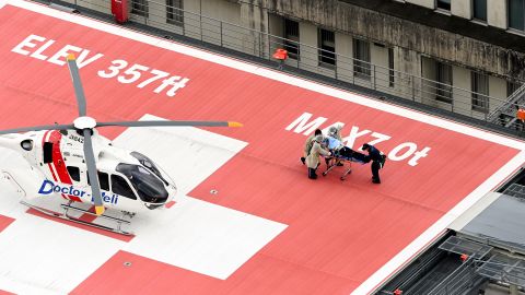 In this aerial image, former Prime Minister Shinzo Abe is on a stretcher to a helicopter after being shot in front of Yamatosaidaiji Station on July 8.