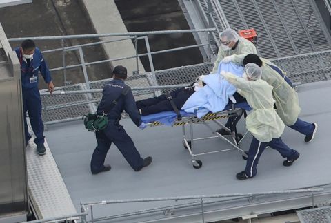 This aerial photo shows a man believed to be Abe on a stretcher at a hospital in Kashihara on Friday.
