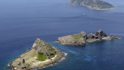 A group of disputed islands, Uotsuri island (top), Minamikojima (bottom) and Kitakojima, known as Senkaku in Japan and Diaoyu in China is seen in the East China Sea, in this photo taken by Kyodo September 2012. Japan and ally the United States sharply criticized China's move to impose new rules on airspace over islands at the heart of a territorial dispute with Tokyo, warning of an escalation into the "unexpected" if Beijing enforces the rules. Mandatory credit. REUTERS/Kyodo (JAPAN - Tags: POLITICS MILITARY) ATTENTION EDITORS - FOR EDITORIAL USE ONLY. NOT FOR SALE FOR MARKETING OR ADVERTISING CAMPAIGNS. THIS IMAGE HAS BEEN SUPPLIED BY A THIRD PARTY. IT IS DISTRIBUTED, EXACTLY AS RECEIVED BY REUTERS, AS A SERVICE TO CLIENTS. MANDATORY CREDIT. JAPAN OUT. NO COMMERCIAL OR EDITORIAL SALES IN JAPAN