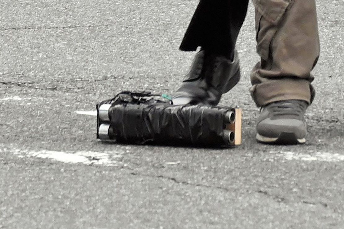 What appears to be a homemade weapon on the ground near where a security officer seized a suspect believed to have shot former Prime Minister Shinzo Abe in front of Yamatosaidaiji Station on July 8, in Nara, Japan.