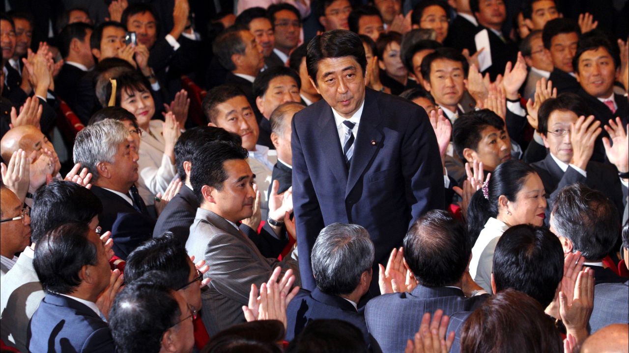 Abe bows to applause from lawmakers of the ruling Liberal Democratic Party after winning the party's presidential election on Sept. 20, 2006. 