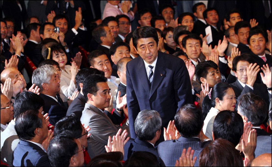 Abe bows to applause from lawmakers of the ruling Liberal Democratic Party after winning the party's presidential election on Sept. 20, 2006. 
