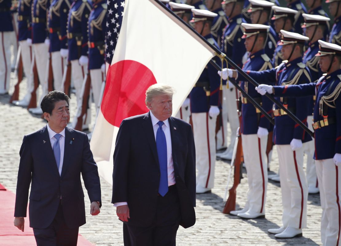 Abe escorts then President Donald Trump during a welcome ceremony at Akasaka Palace, Nov. 6, 2017.