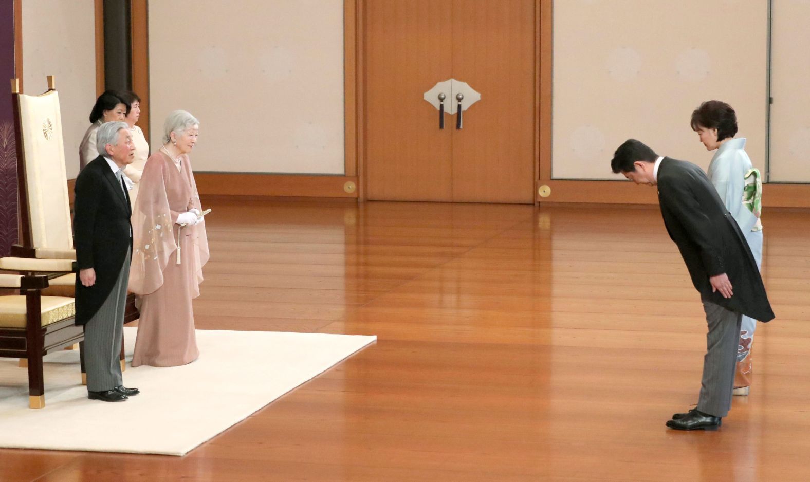 Abe and his wife, Akie, greet Japanese Emperor Akihito and Empress Michiko on their 60th wedding anniversary in 2019.