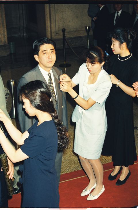 Abe receives the National Diet member's pin at his first legislature session in 1993.
