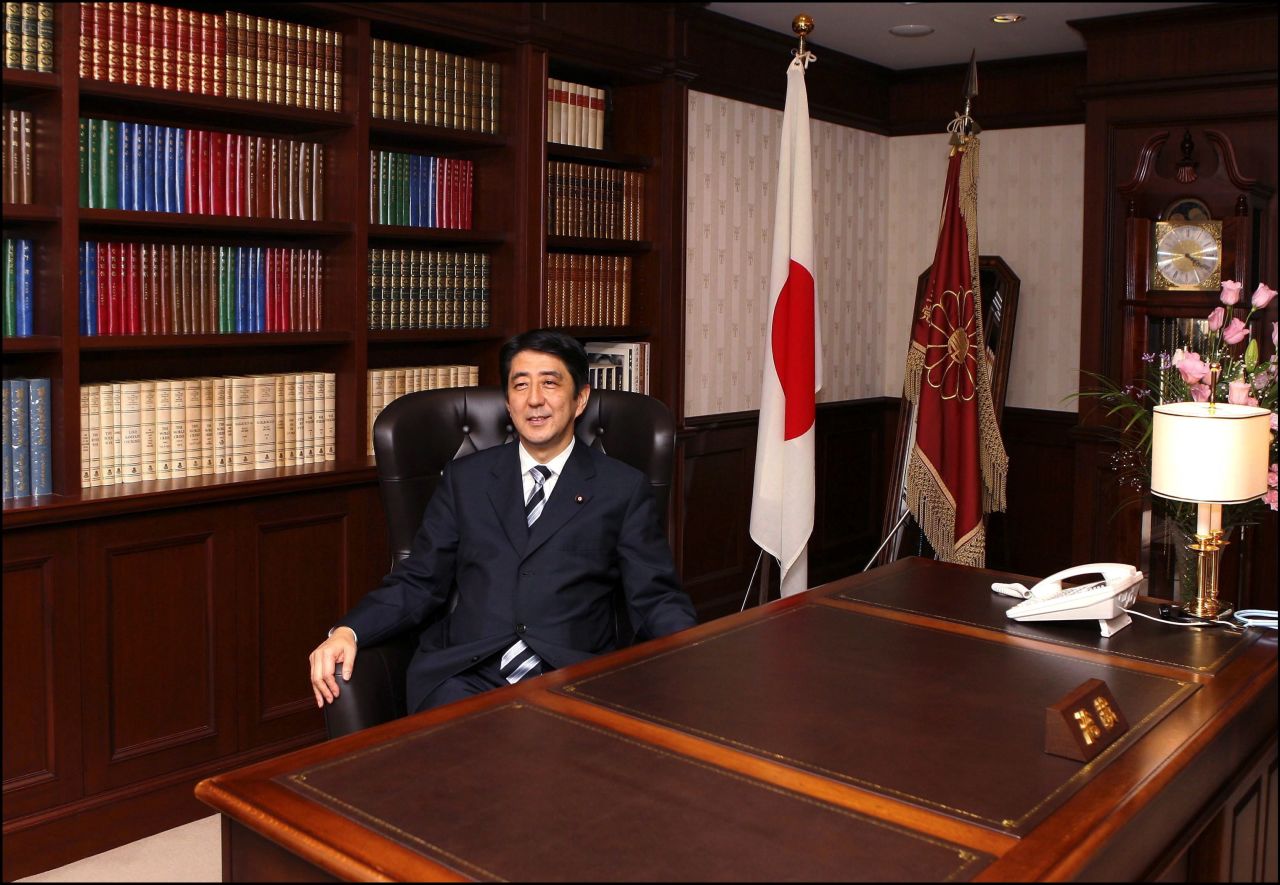 Abe settles into his party's presidential seat in 2006 after succeeding Koizumi as Japan's prime minister.