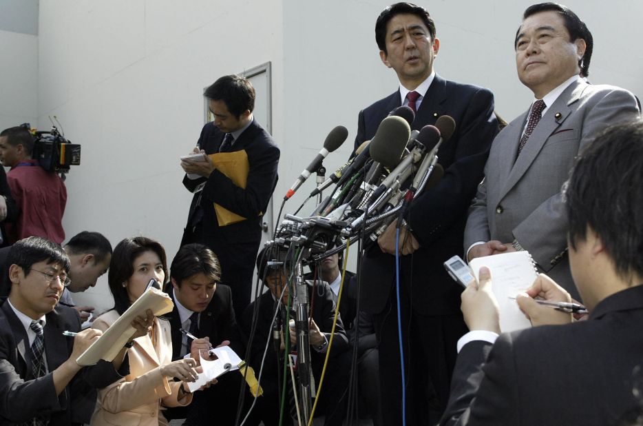 Abe, as secretary general of the ruling Liberal Democratic Party, addresses reporters outside the White House after meeting with then-US National Security Advisor Condoleezza Rice in 2004.