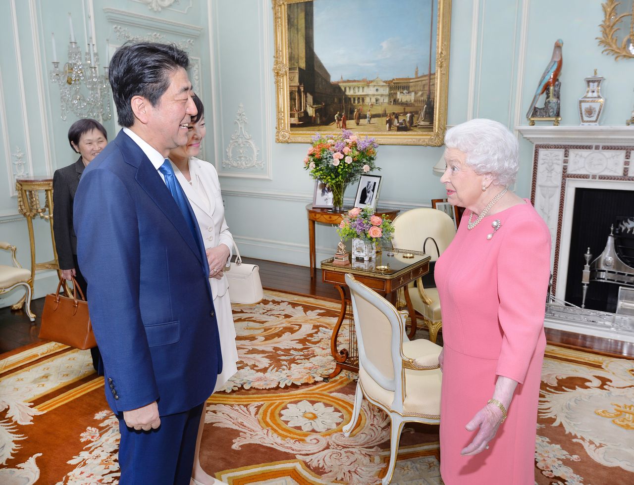Abe and his wife, Akie, visit Britain's Queen Elizabeth II at Buckingham Palace in 2016.