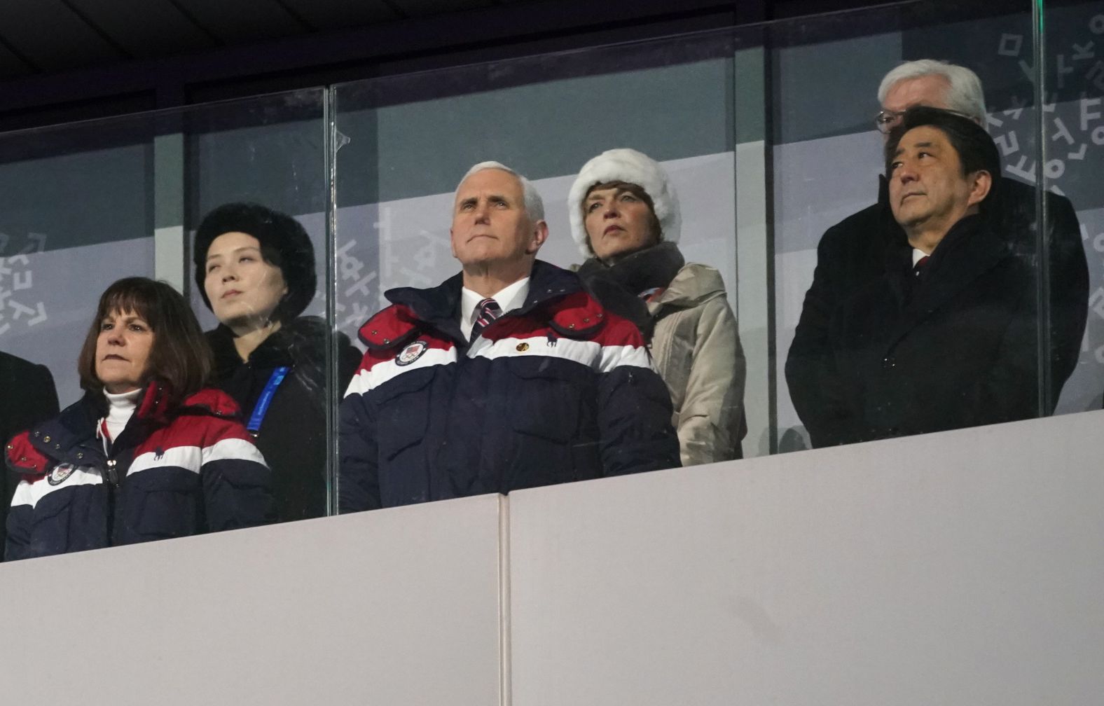 US Vice President Mike Pence is flanked by his wife, Karen, and Abe during the opening ceremony of the 2018 Winter Olympics in Pyeongchang, South Korea. Kim Yo-jong, sister of North Korean leader Kim Jong-un, is standing at left in the back row.