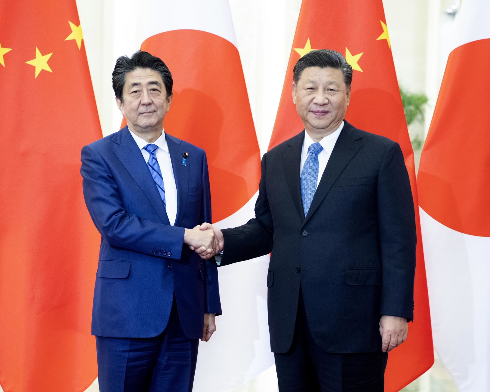 Abe meets with Chinese President Xi Jinping at the Great Hall of the People in Beijing in 2019.