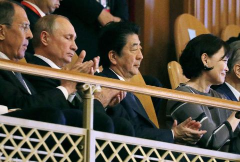 Abe sits next to Russian President Vladimir Putin at a ceremony for a cultural exchange project in Osaka, Japan, in 2019.