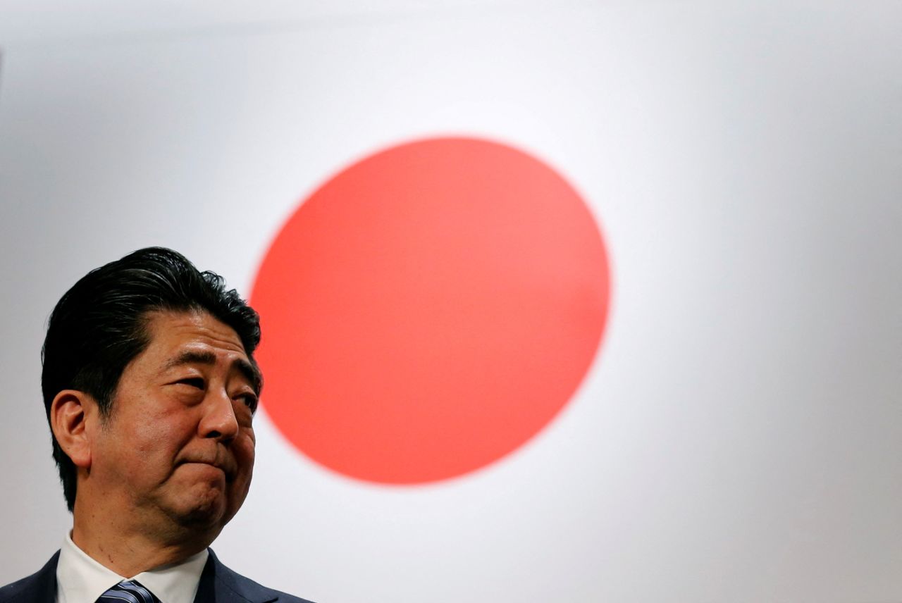 Abe stands in front of the Japanese flag after the Liberal Democratic Party's annual convention in 2017.