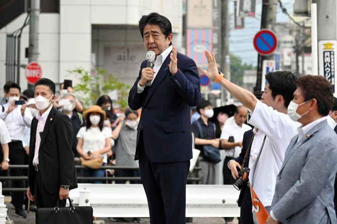 Former Prime Minister Shinzo Abe speaks moments before being shot in front of the Yamato-Saidaiji Station in Nara, Japan, on Friday, July 8.