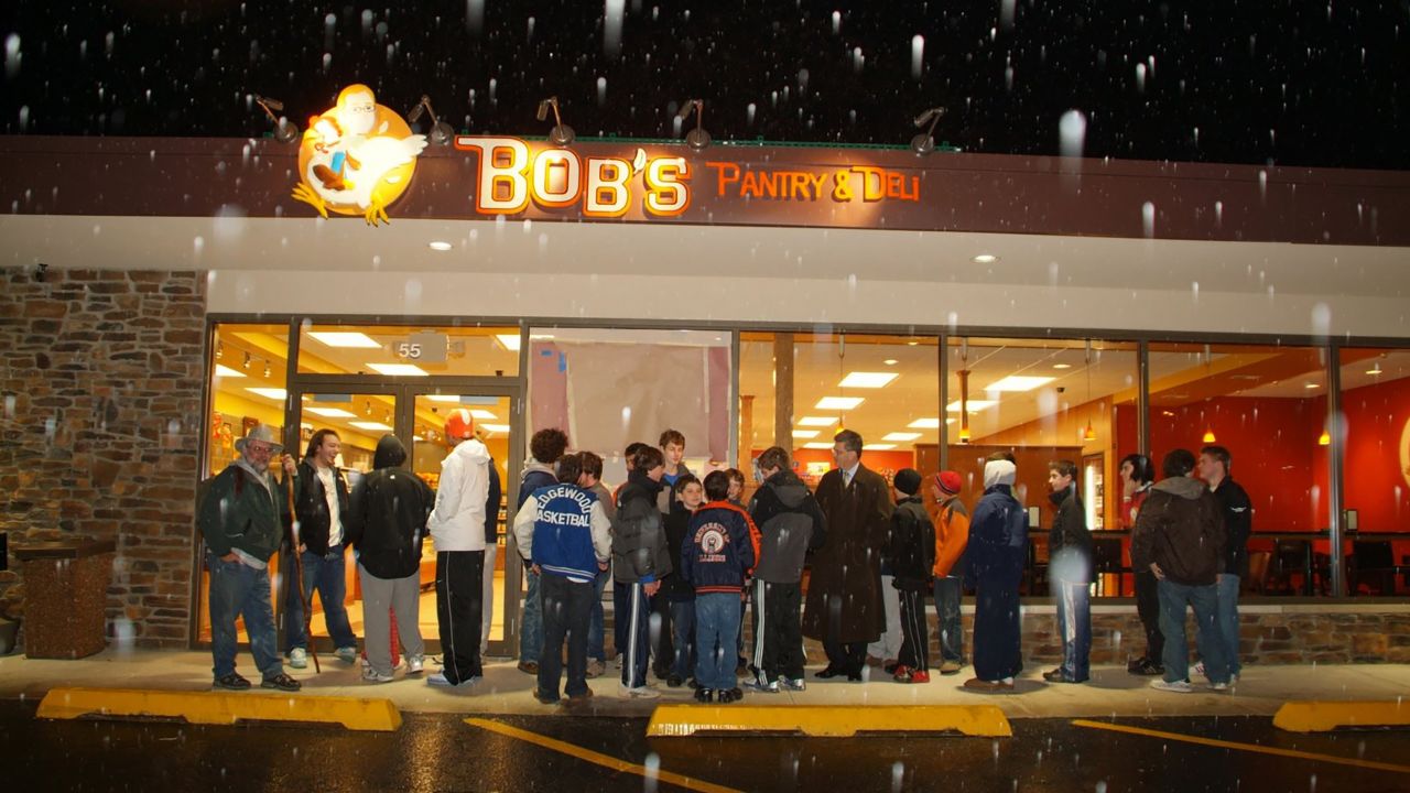 Loyal customers eagerly await the opening of Bob Crimo's deli in 2008.