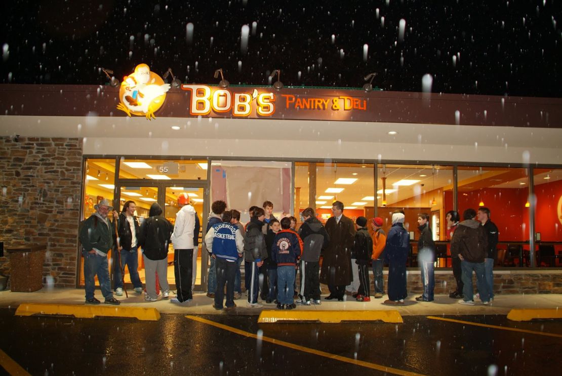 Loyal customers eagerly await the opening of Bob Crimo's deli in 2008.