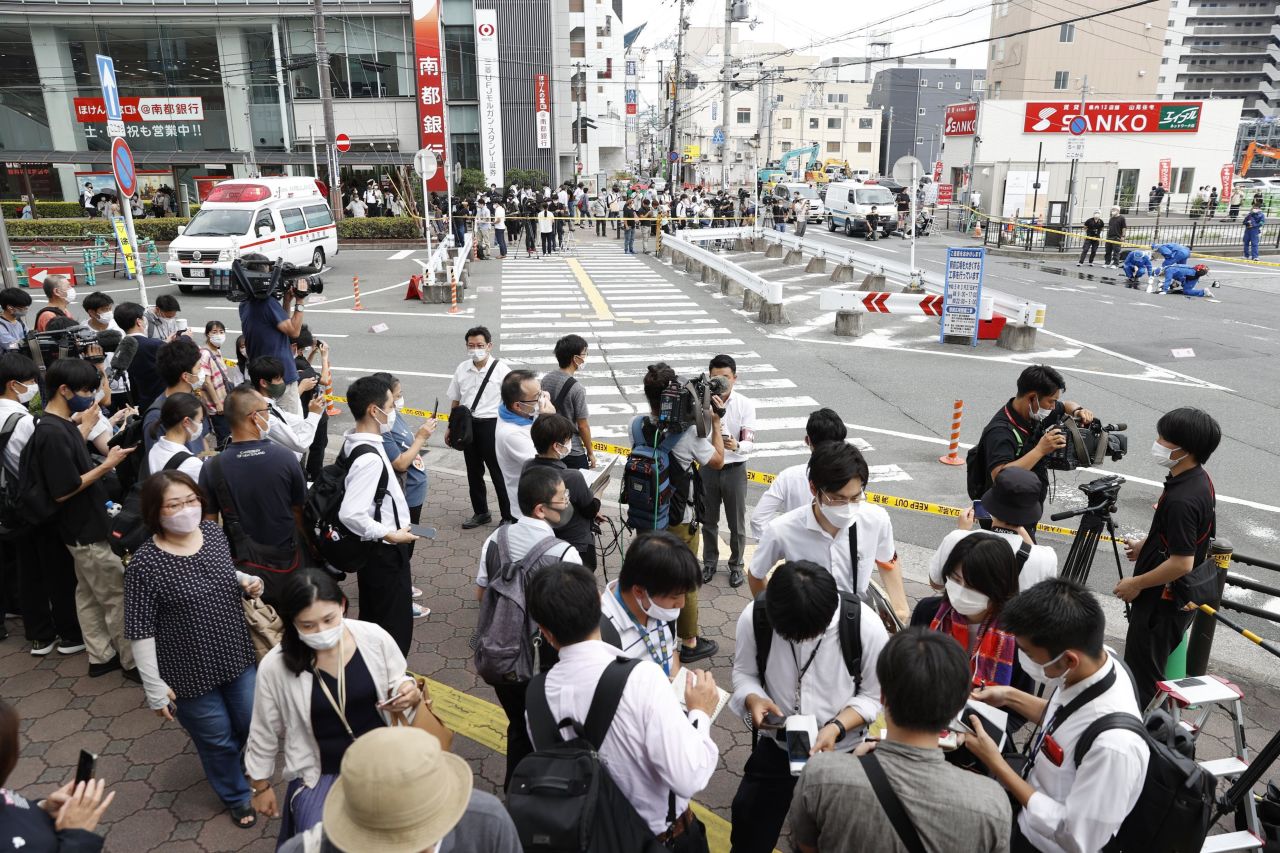 Media crews gather in an area near the Yamato-Saidaiji Station in Nara on Friday.