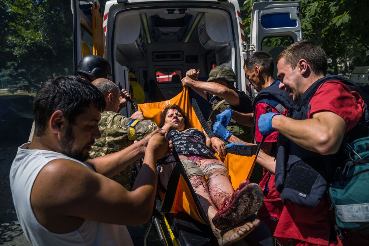 A wounded woman is transported to an ambulance in Kramatorsk, Ukraine, on July 7.