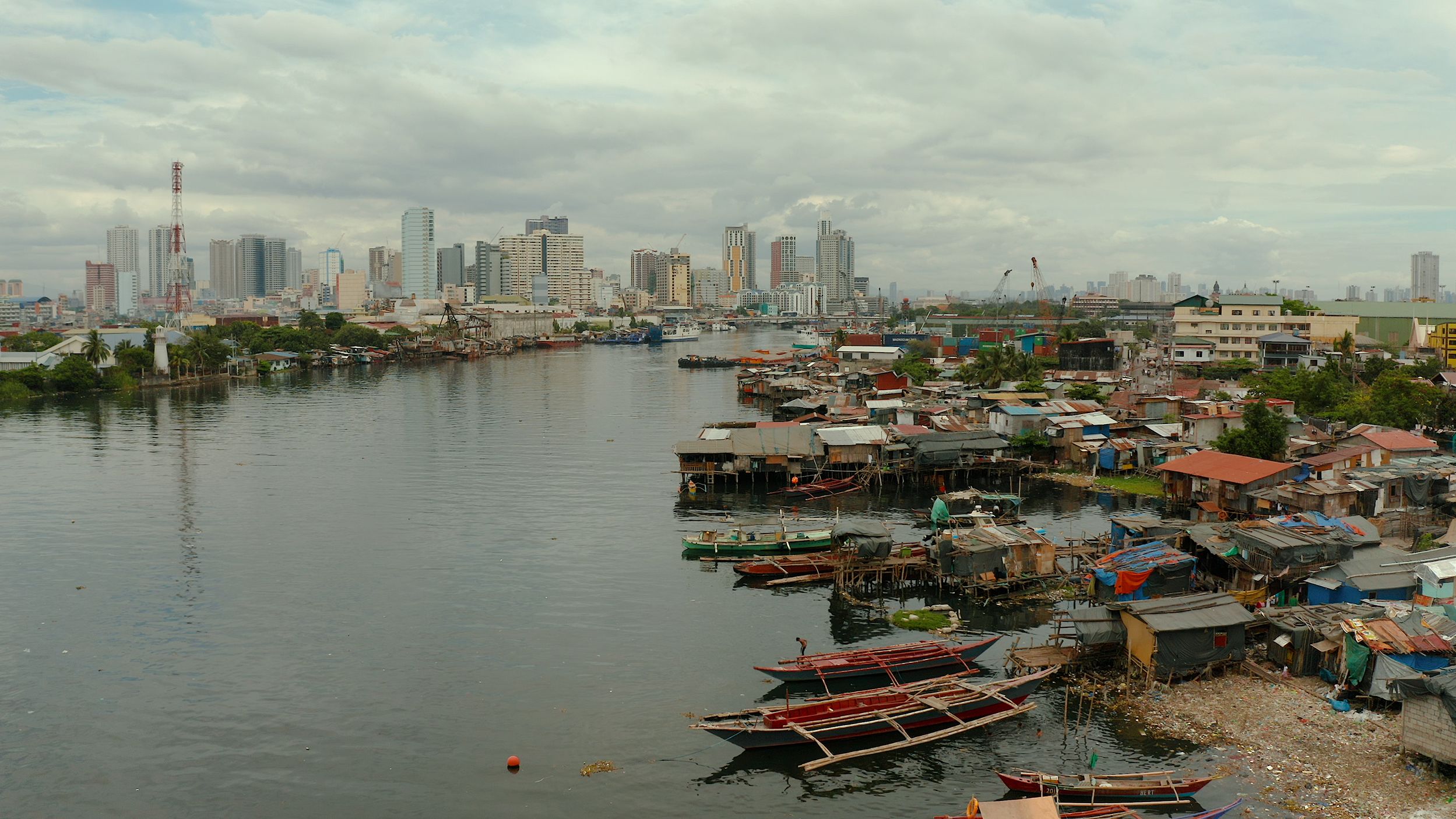 Manila, the sprawling capital of the Philippines where millions live in slums against the backdrop of modern skyscrapers