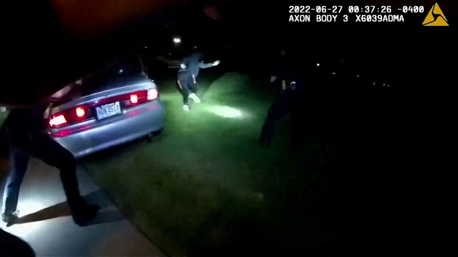 Jayland Walker exits his vehicle and runs before being shot to death by up to eight officers in Akron, Ohio, last month in a still image from police body camera video. 