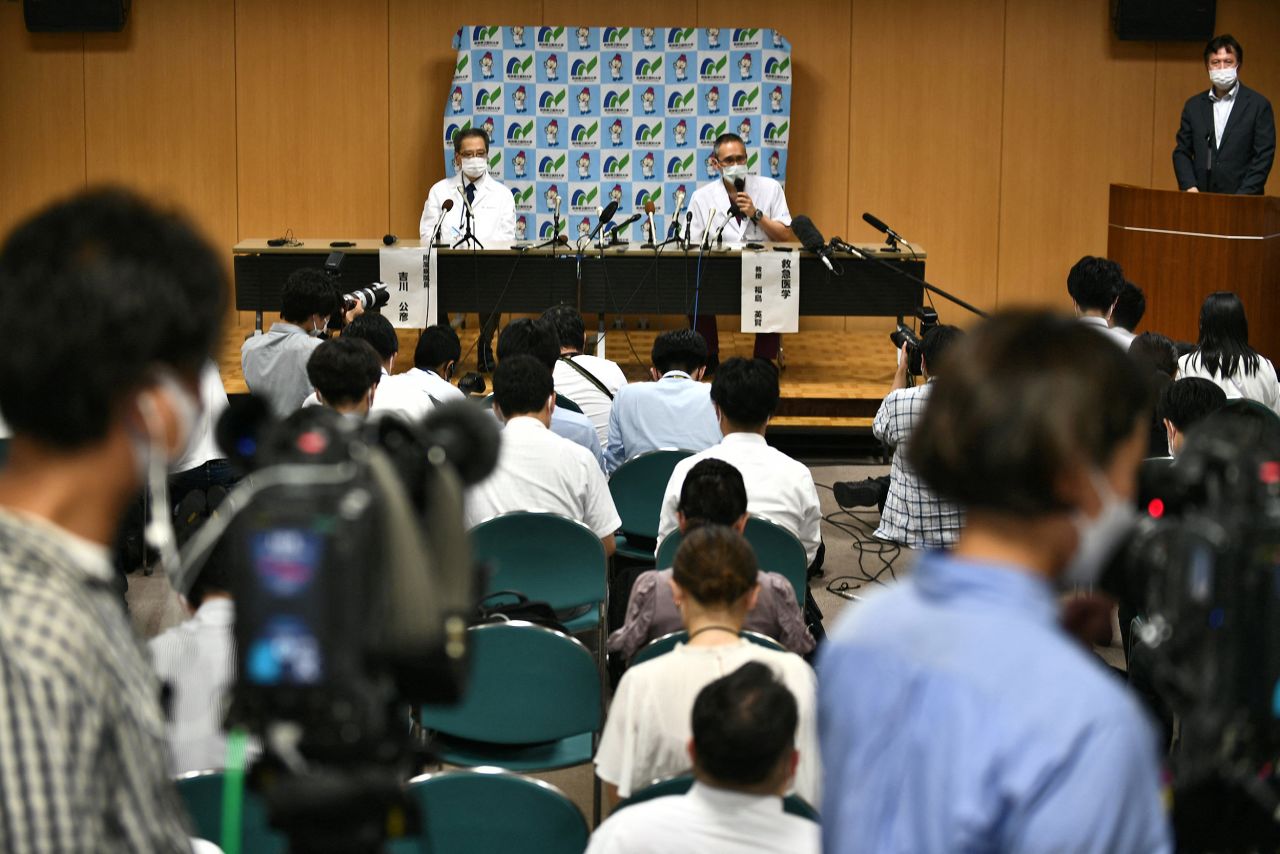 Head of University Hospital Kimihiko Kichikawa, center left, and professor of emergency medicine, Hidetada Fukushima, hold a press conference in Kashihara, Japan, where Abe was confirmed dead on Friday.