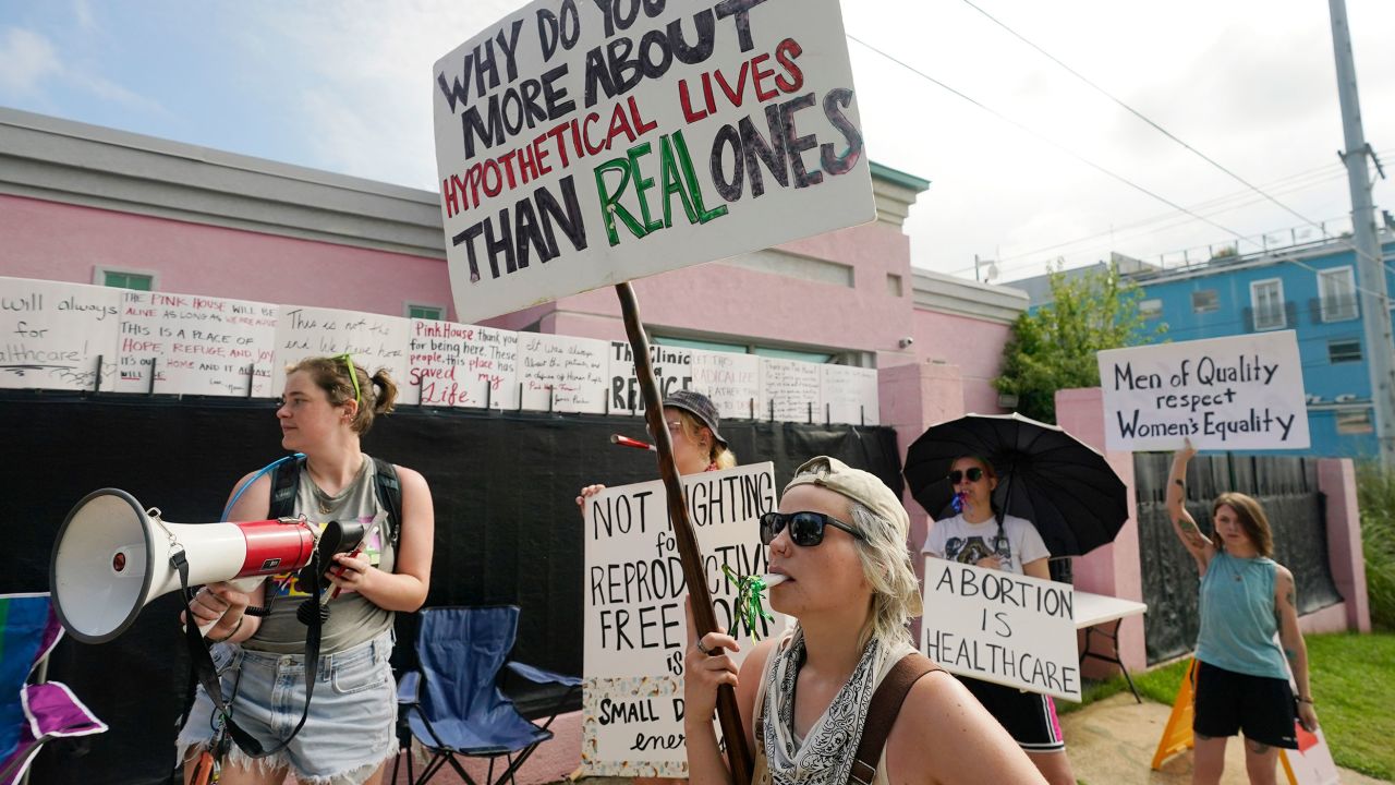 Abortion rights advocates stand outside the Jackson Women's Health Organization clinic in Jackson, Mississippi, and attempt to shout down a group of abortion opponents, on July 7, 2022.