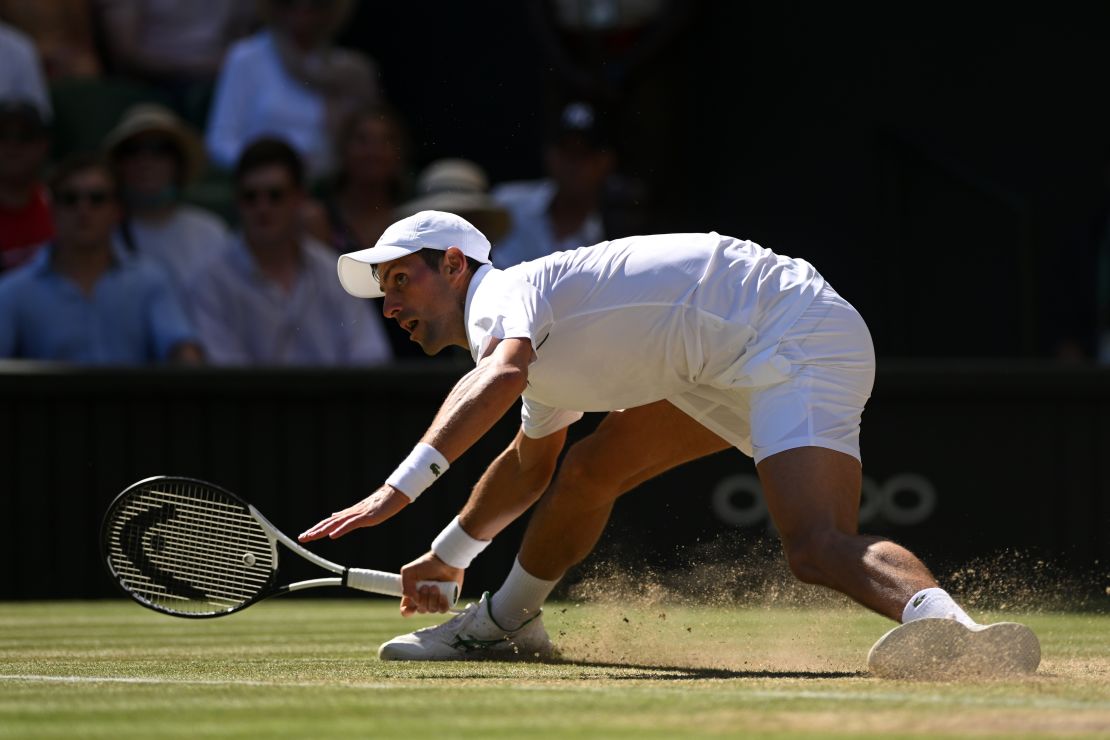 Djokovic slides for a shot against Norrie during their Wimbledon quarterfinal. 