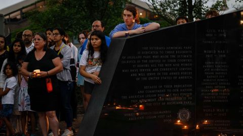 Residents attend a memorial for the victims of the July 4th parade shooting in Highland Park, Illinois, on July 5.