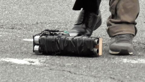 What appears to be a homemade weapon lies near where a security officer arrested a suspect on July 8 in Nara, Japan.