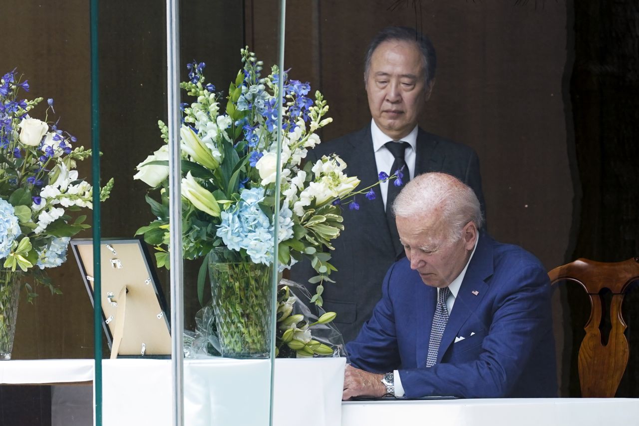 US President Joe Biden signs a condolence book at the Japanese ambassador's residence in Washington, DC, on July 8.