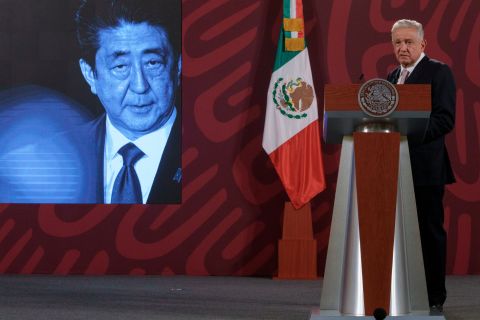 A photo of former Japanese prime minister Shinzo Abe is displayed on the screen as Mexican President Andres Manuel Lopez Obrador offers his condolences.