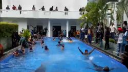 Protesters enter the pool in the presidential house in Sri Lanka. (WhatsApp). 18414869