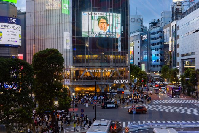 A screen at Tokyo's Shibuya Crossing shows news of Abe's death on Saturday.
