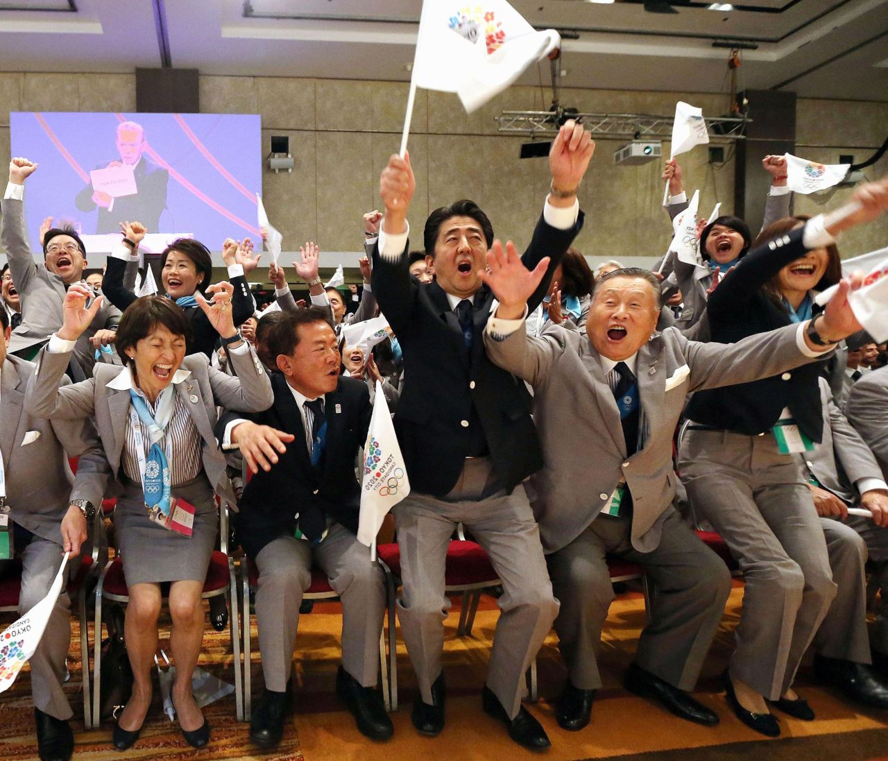 Abe, center, and former Prime Minister Yoshiro Mori, right, with other delegates, celebrate after Tokyo was awarded the 2020 Summer Olympic Games, in Buenos Aires, Argentina in 2013.