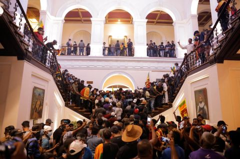People protest inside the President's House on Saturday.