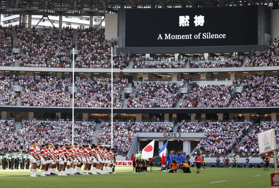 Rugby players from Japan and France observe a moment of silence before a match in Tokyo on Saturday.