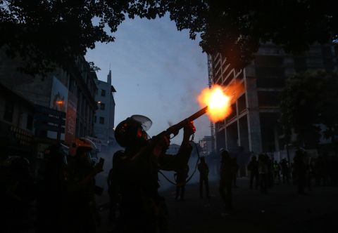 Police use tear gas to disperse university students protesting in Colombo on Friday.