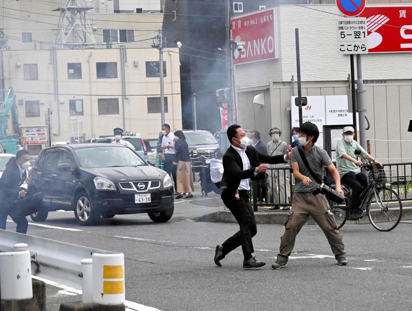 A police officer detains <a href="https://www.cnn.com/2022/07/09/asia/shinzo-abe-tetsuya-yamagami-explainer-intl-hnk/index.html" target="_blank">suspect Tetsuya Yamagami</a> after the shooting on Friday.